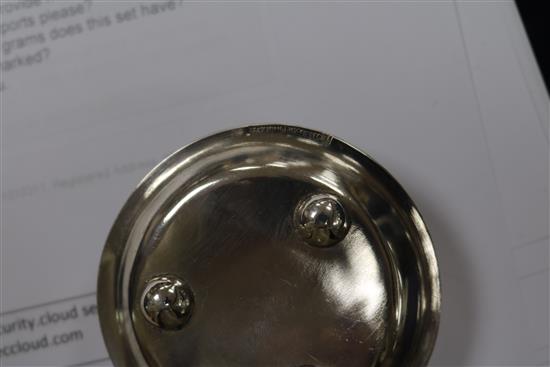 A Chinese silver sugar bowl and two tea strainers.